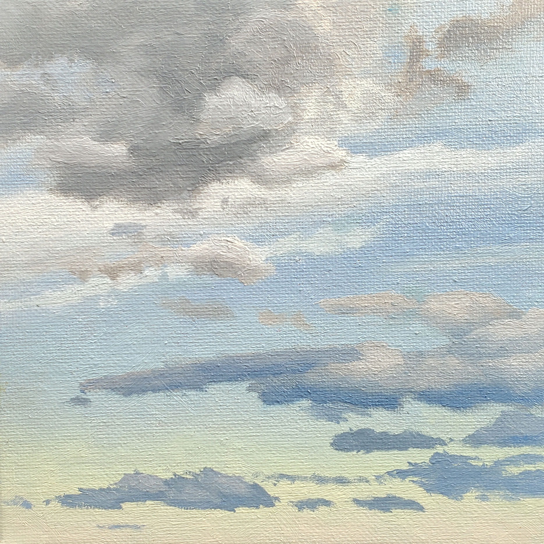 overlapping clouds against a light blue to butter yellow sky gradient