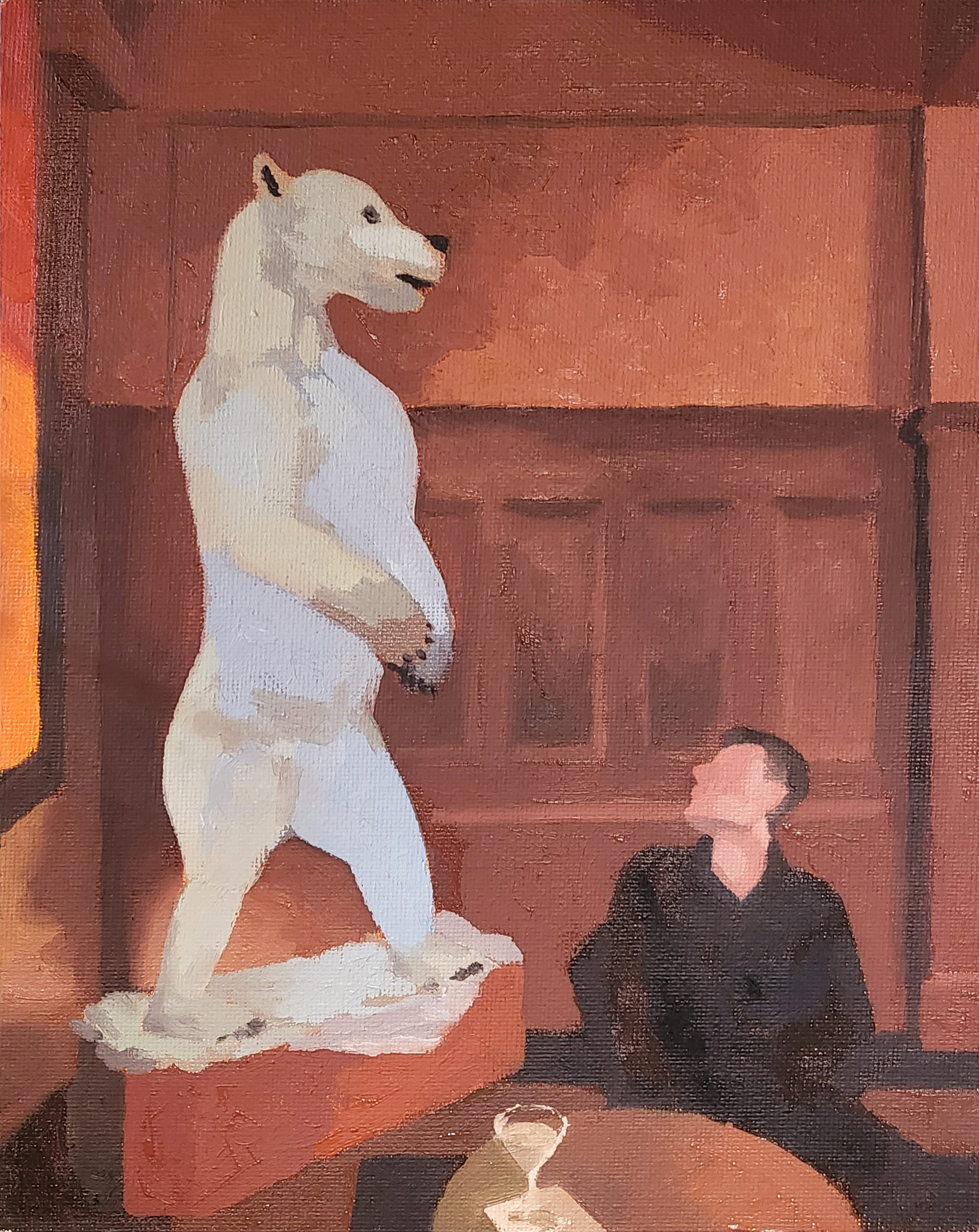 seated figure looking up at a lit up polar bear sculpture in a wood paneled room