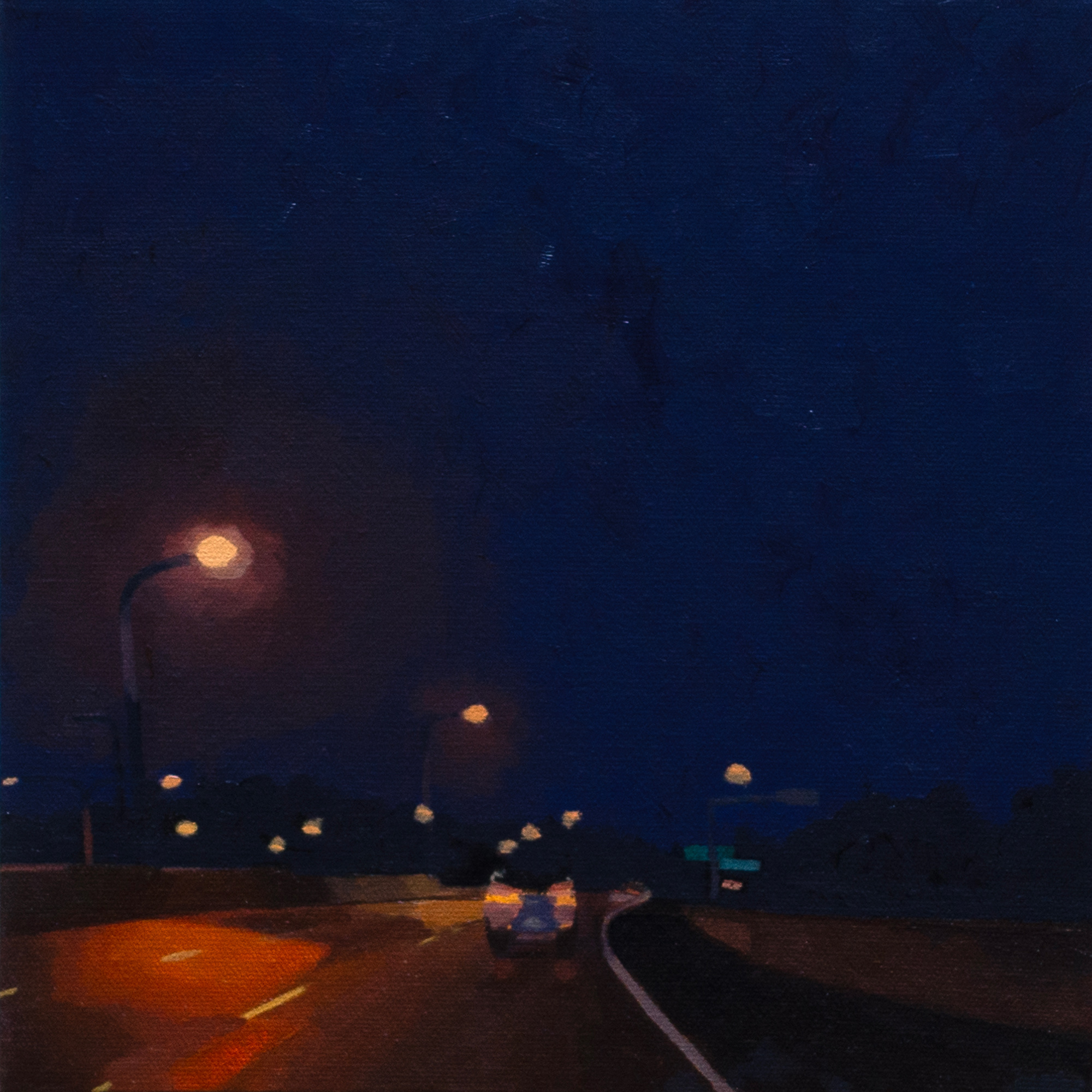 freeway at night with warm streetlamps