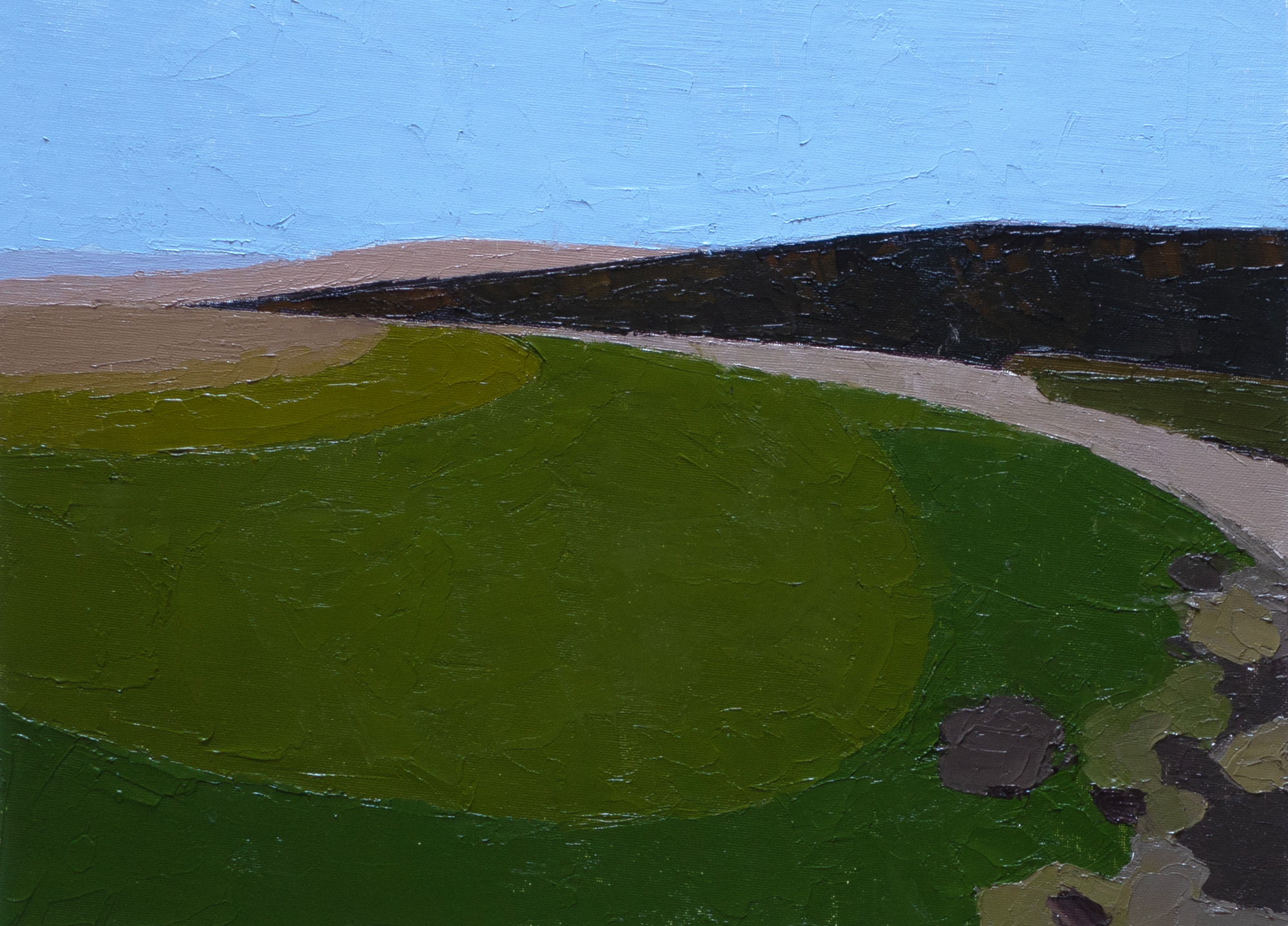 green landscape with brown cliffs