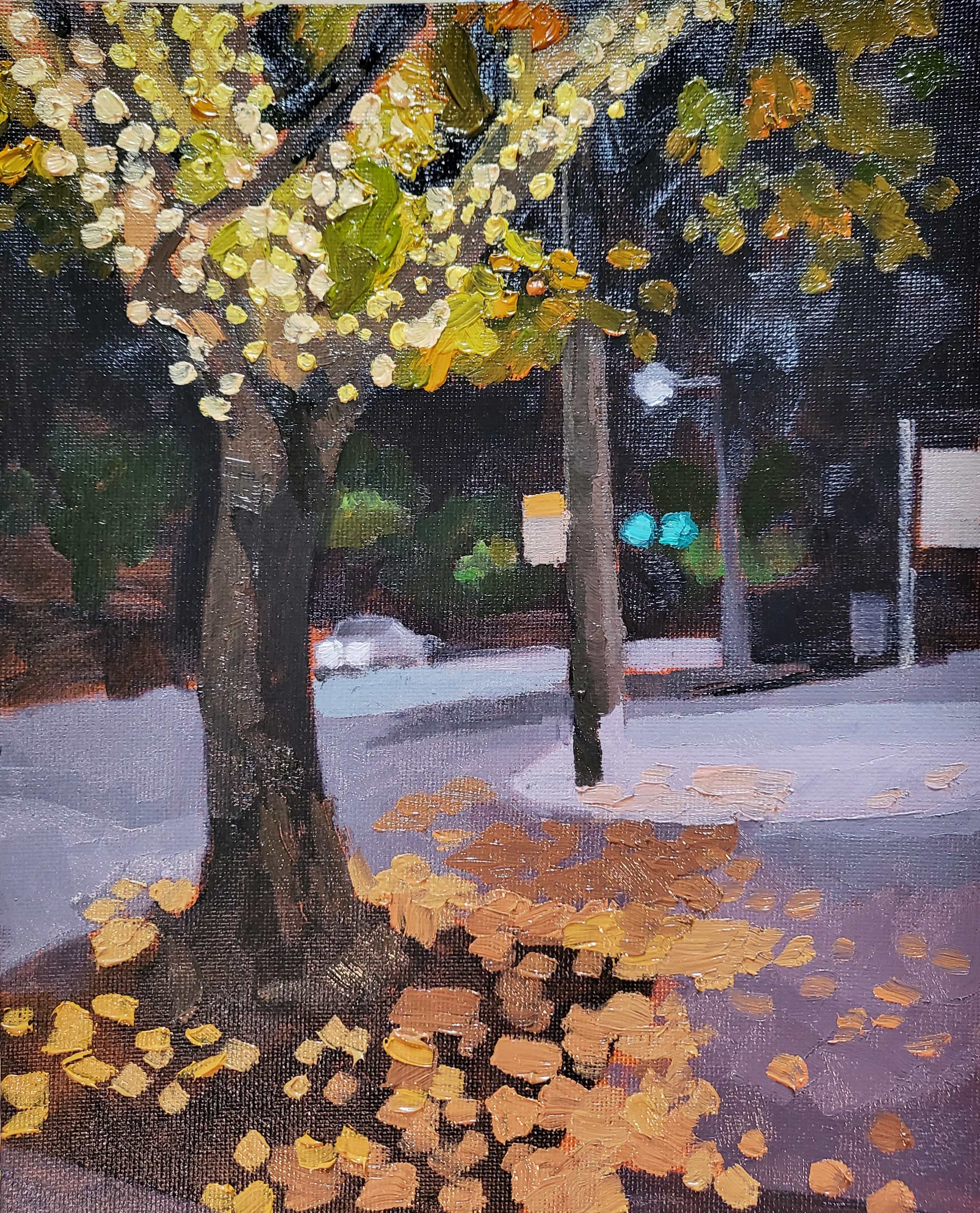 tree with golden fall foliage and string lights