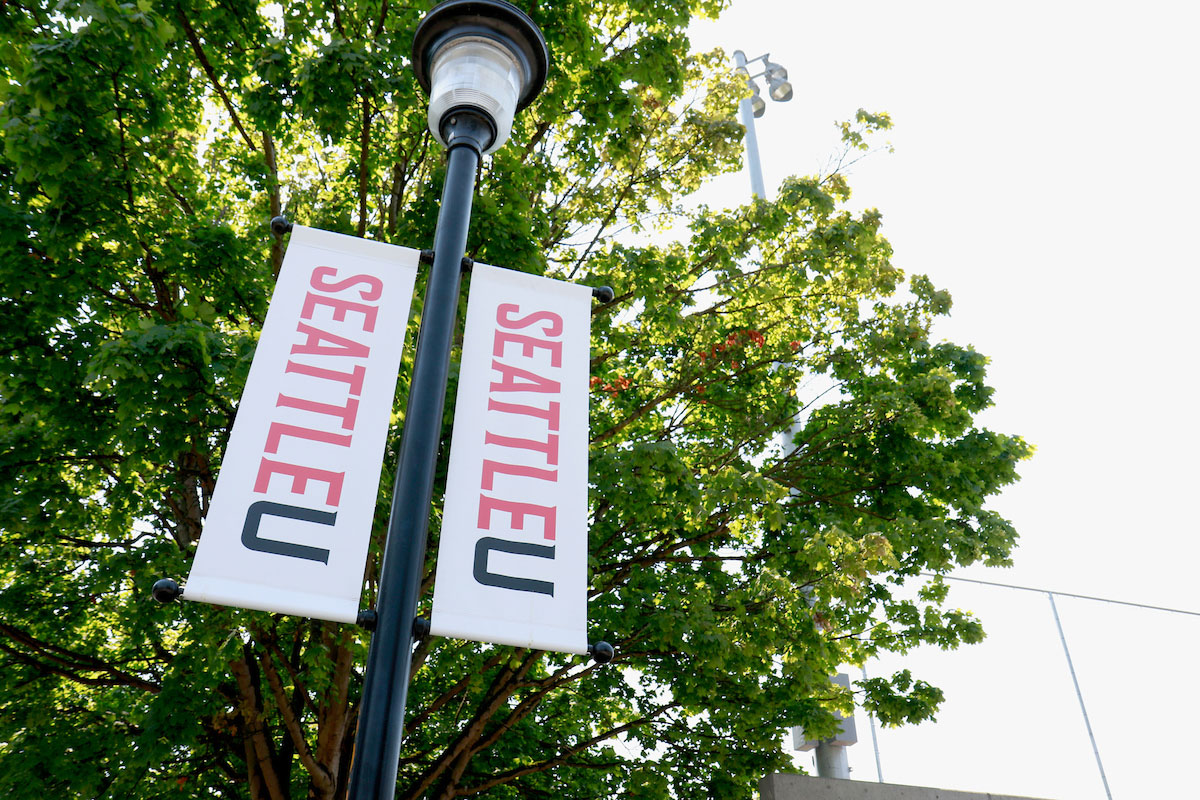 Street banners along 12th Avenue featuring classic SU spirit mark